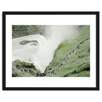 Tourists walking around the waterfall - Iceland