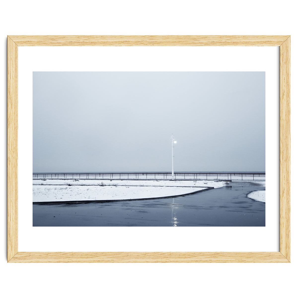 Street light turned on the winter snow street