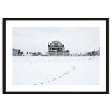 Footprints and house in winter snowscape thumbnail