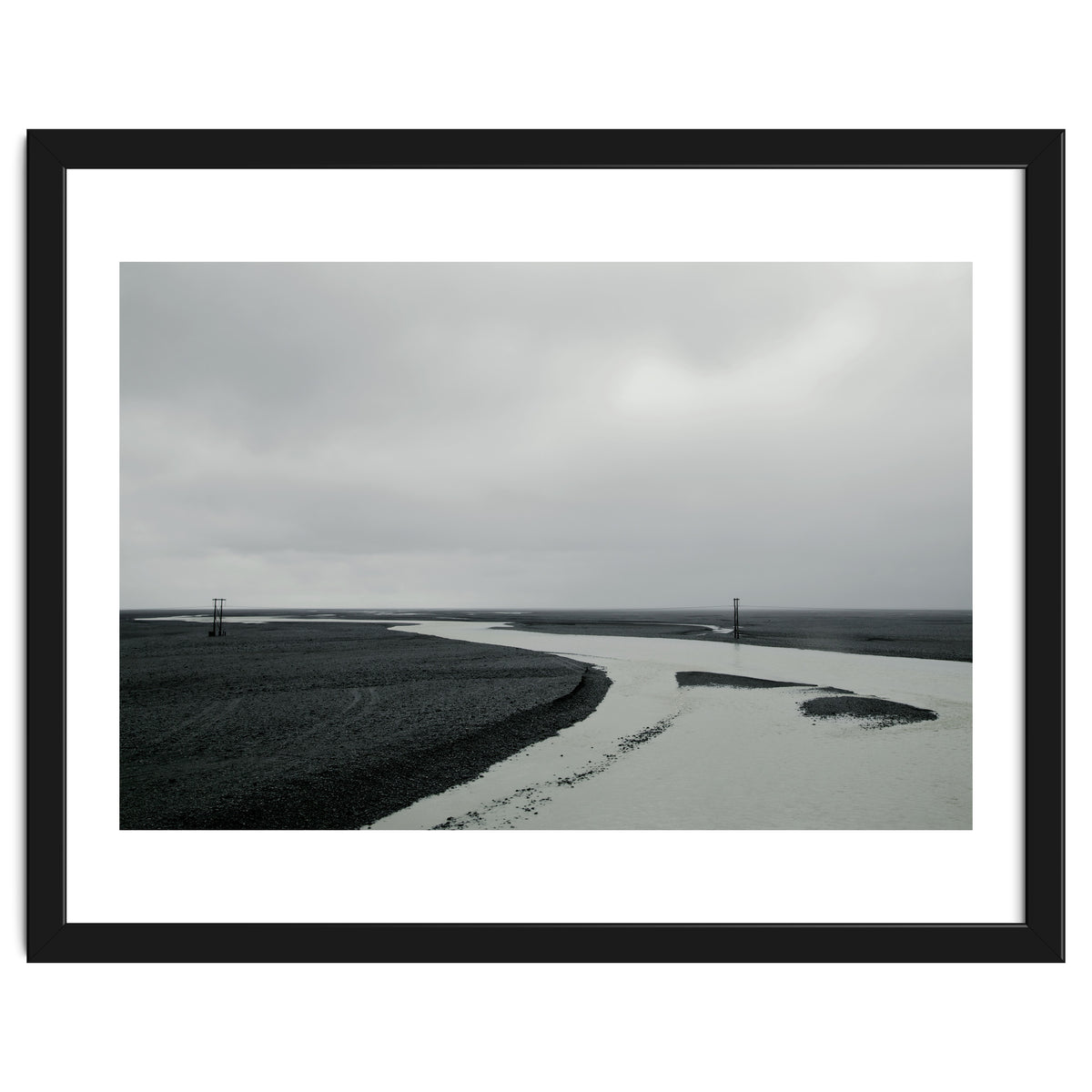 River passing through a black volcanic road - Iceland