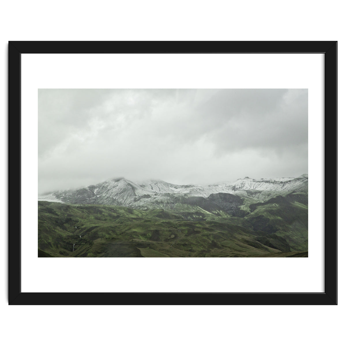 Snow-covered green mountains - Iceland