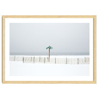 Fake palm tree in the winter snow beach