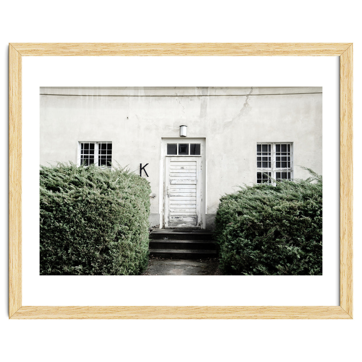 White door K between the green botanical gate