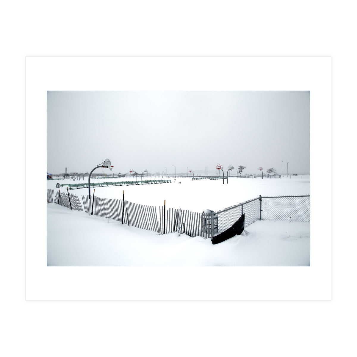 Snow-covered deserted basketball court in winter (Print Only)