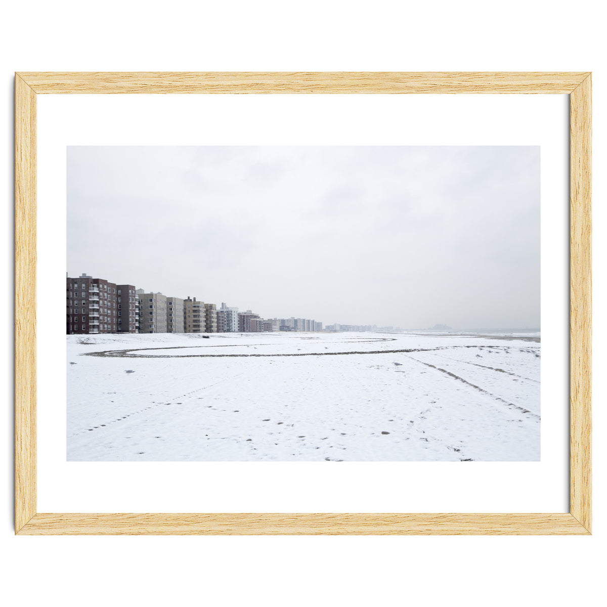 Traces of driving a car on a snowy coast