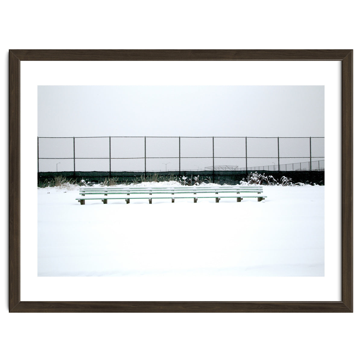 Bench with no people in snowy winter