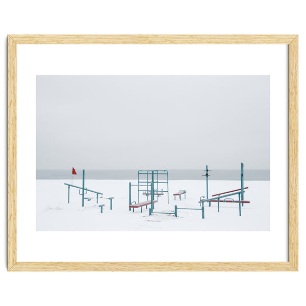 Playground in the winter snow beach