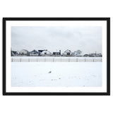 A seagull and snow covered houses thumbnail