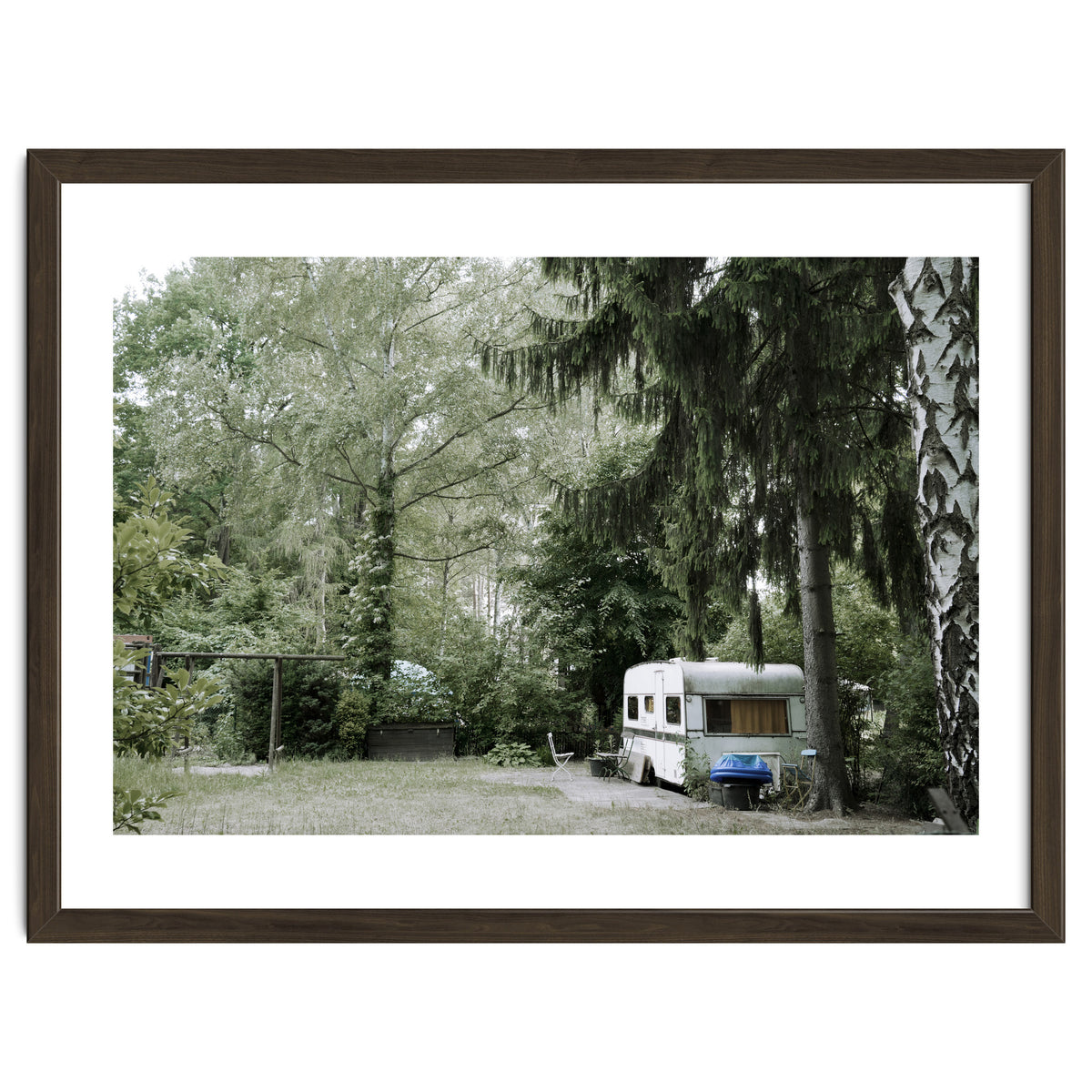 Travel trailer in the green garden
