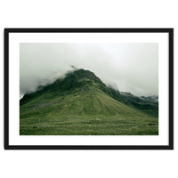 Green mountain covered in clouds - Iceland