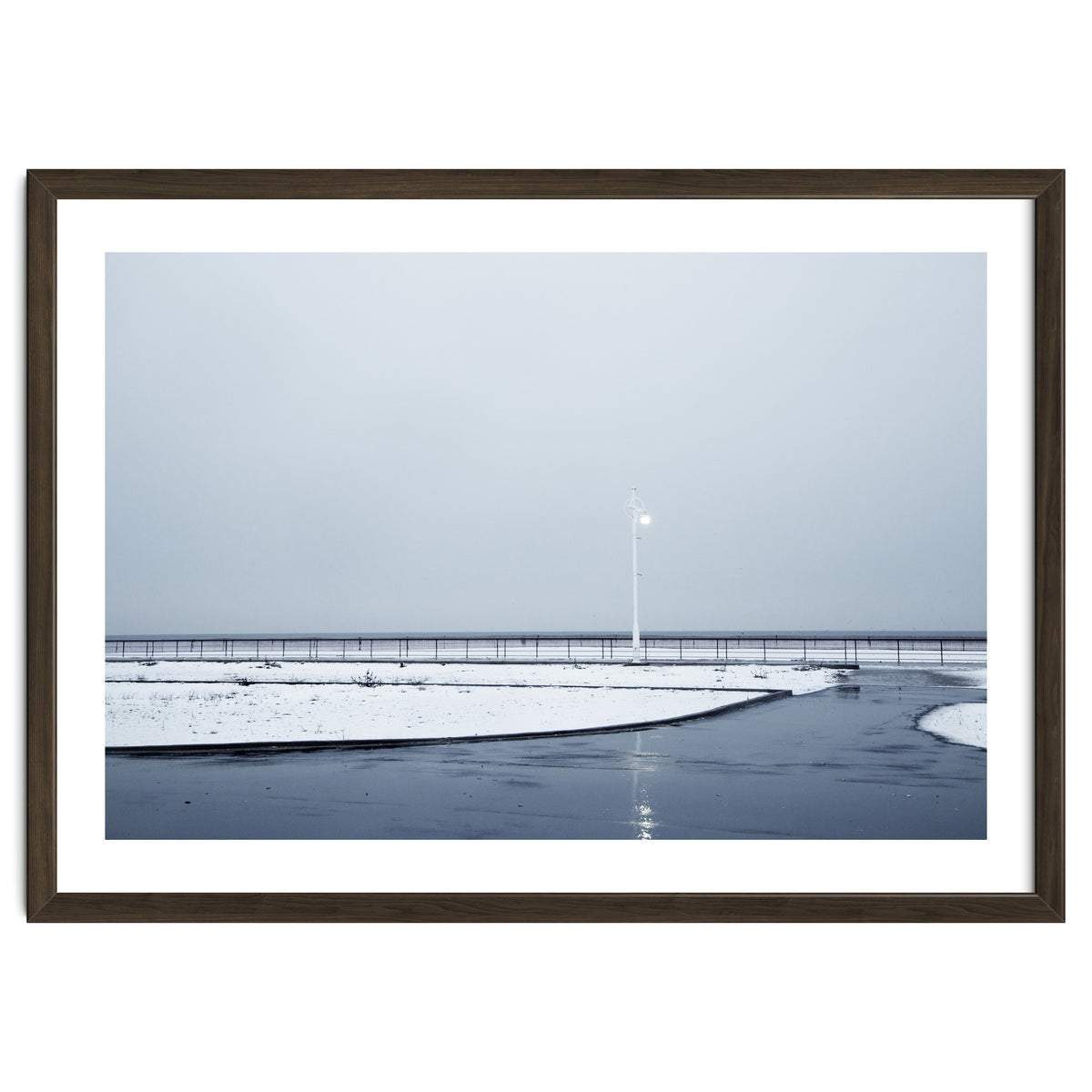 Street light turned on the winter snow street