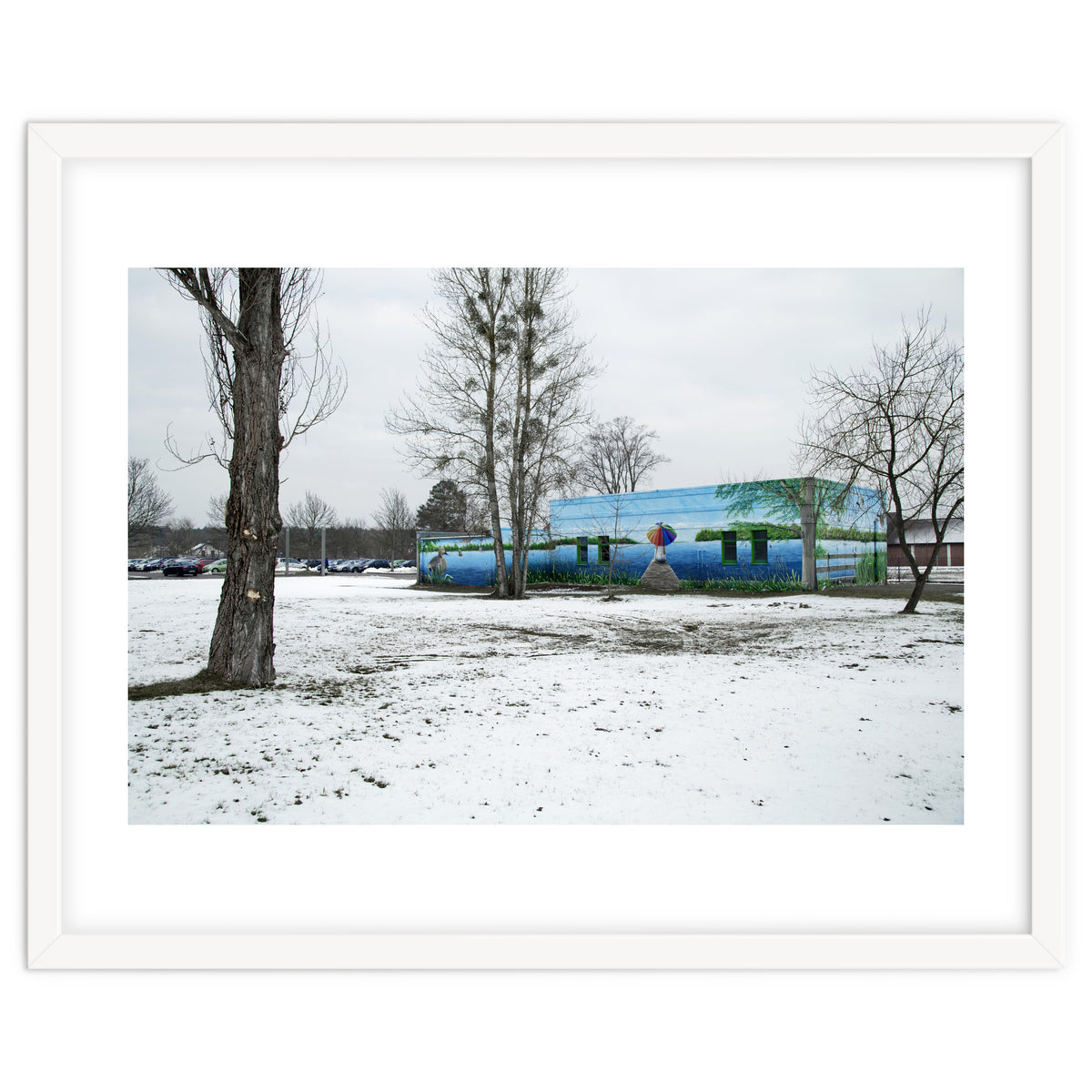 Colorful barn in the snowy ground landscape
