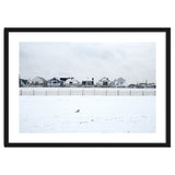 A seagull and snow covered houses thumbnail