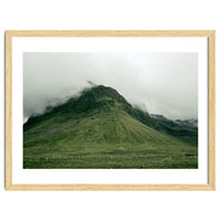 Green mountain covered in clouds - Iceland