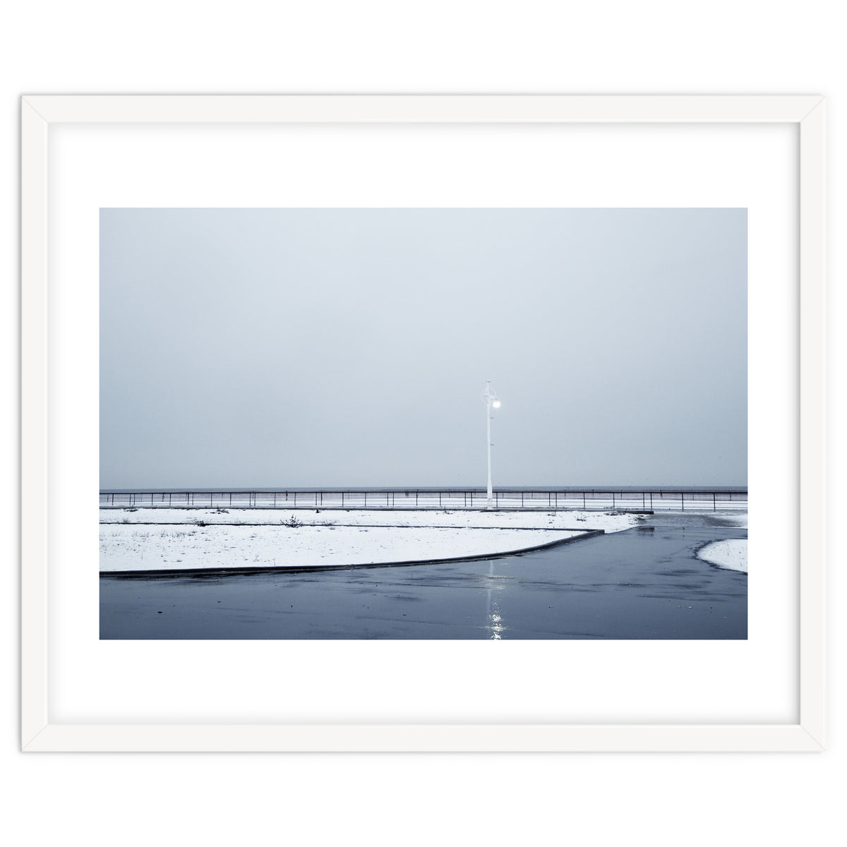 Street light turned on the winter snow street