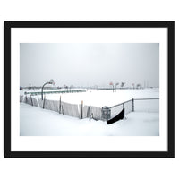 Snow-covered deserted basketball court in winter