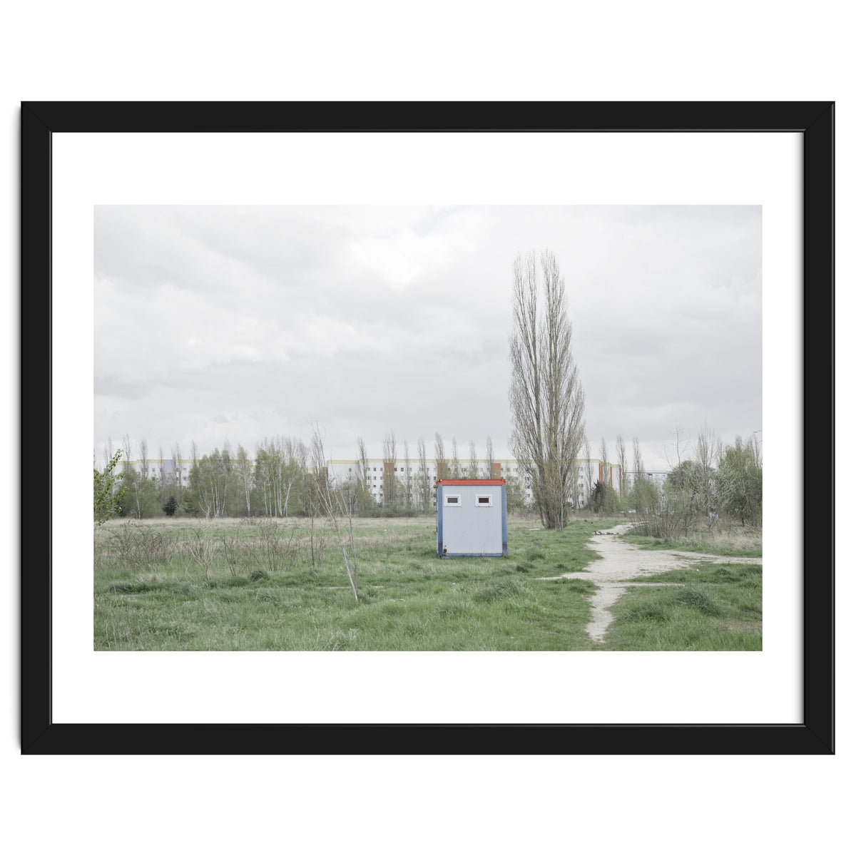 Hut in the middle of green field