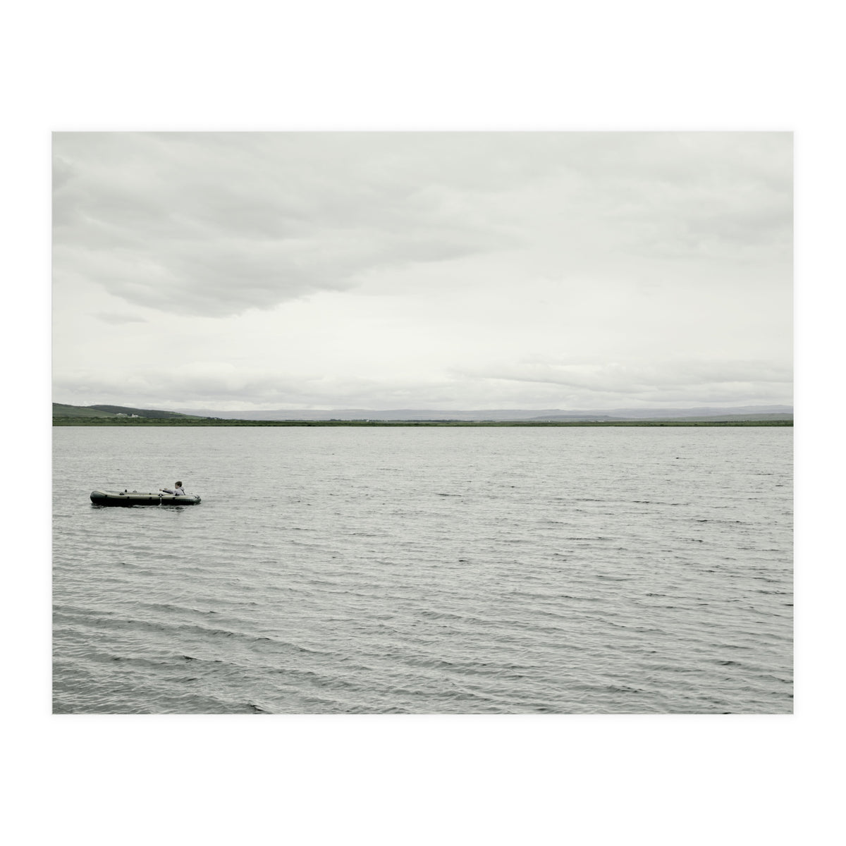 A boy pedaling the Board on the Lake - Iceland (Print Only)