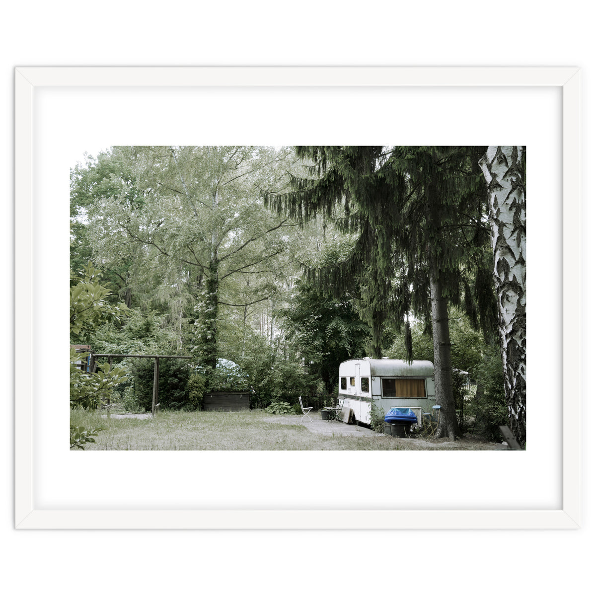 Travel trailer in the green garden
