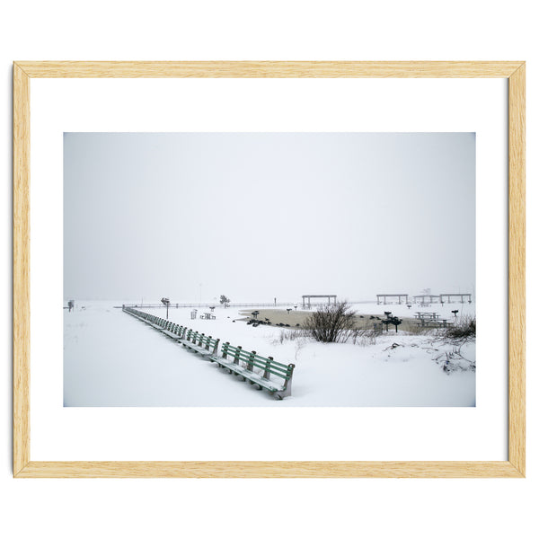 No people on a bench in the snowy winter