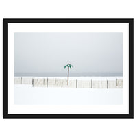 Fake palm tree in the winter snow beach