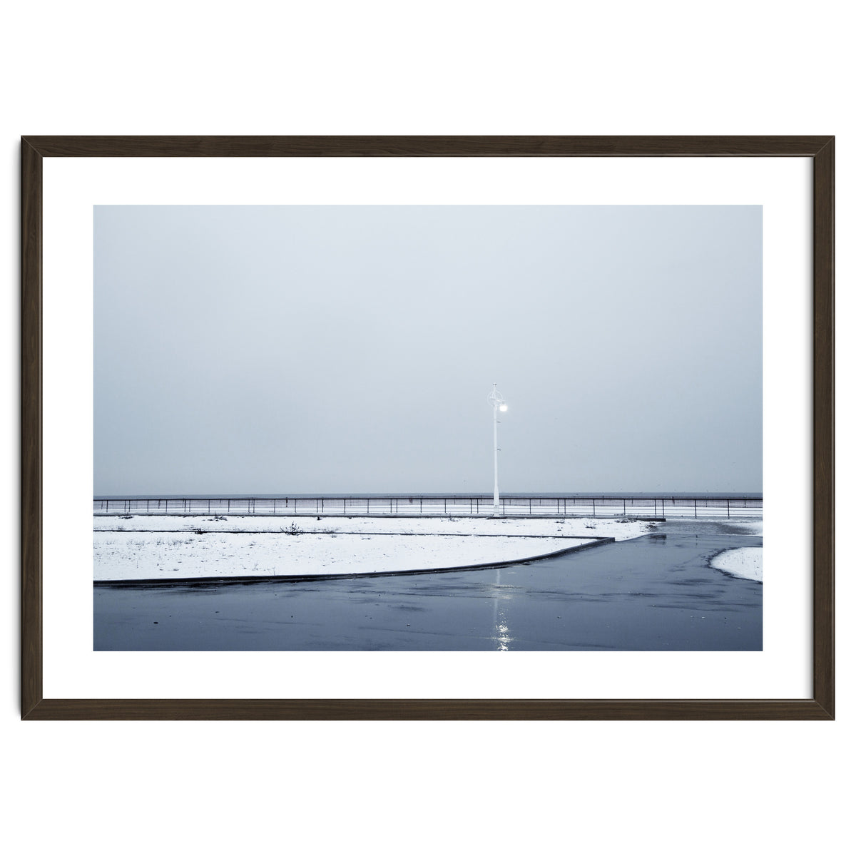 Street light turned on the winter snow street