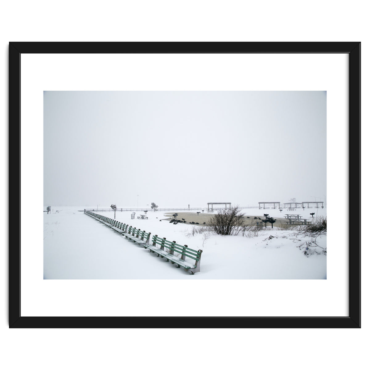 No people on a bench in the snowy winter