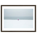 A walking woman in the winter snow beach thumbnail