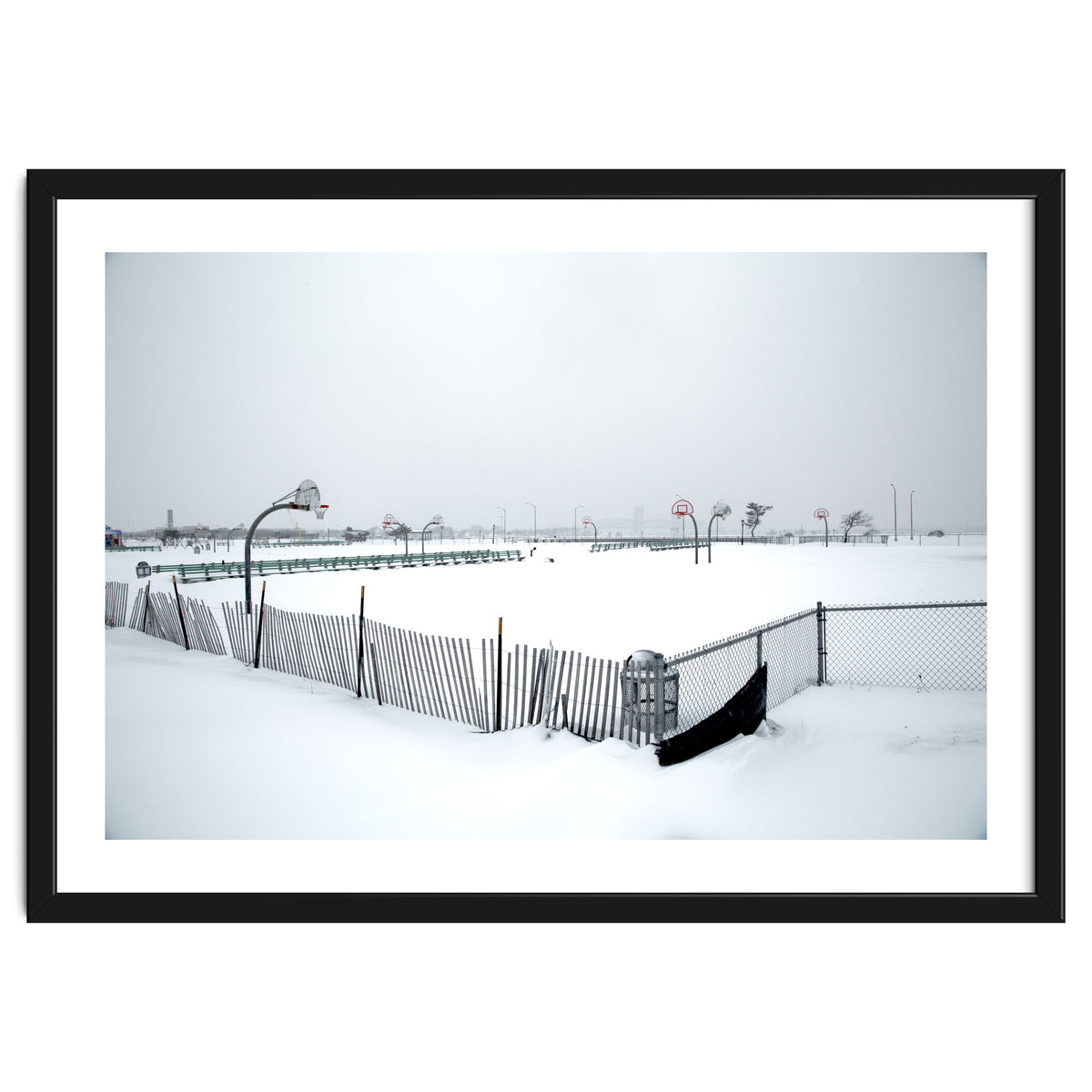 Snow-covered deserted basketball court in winter