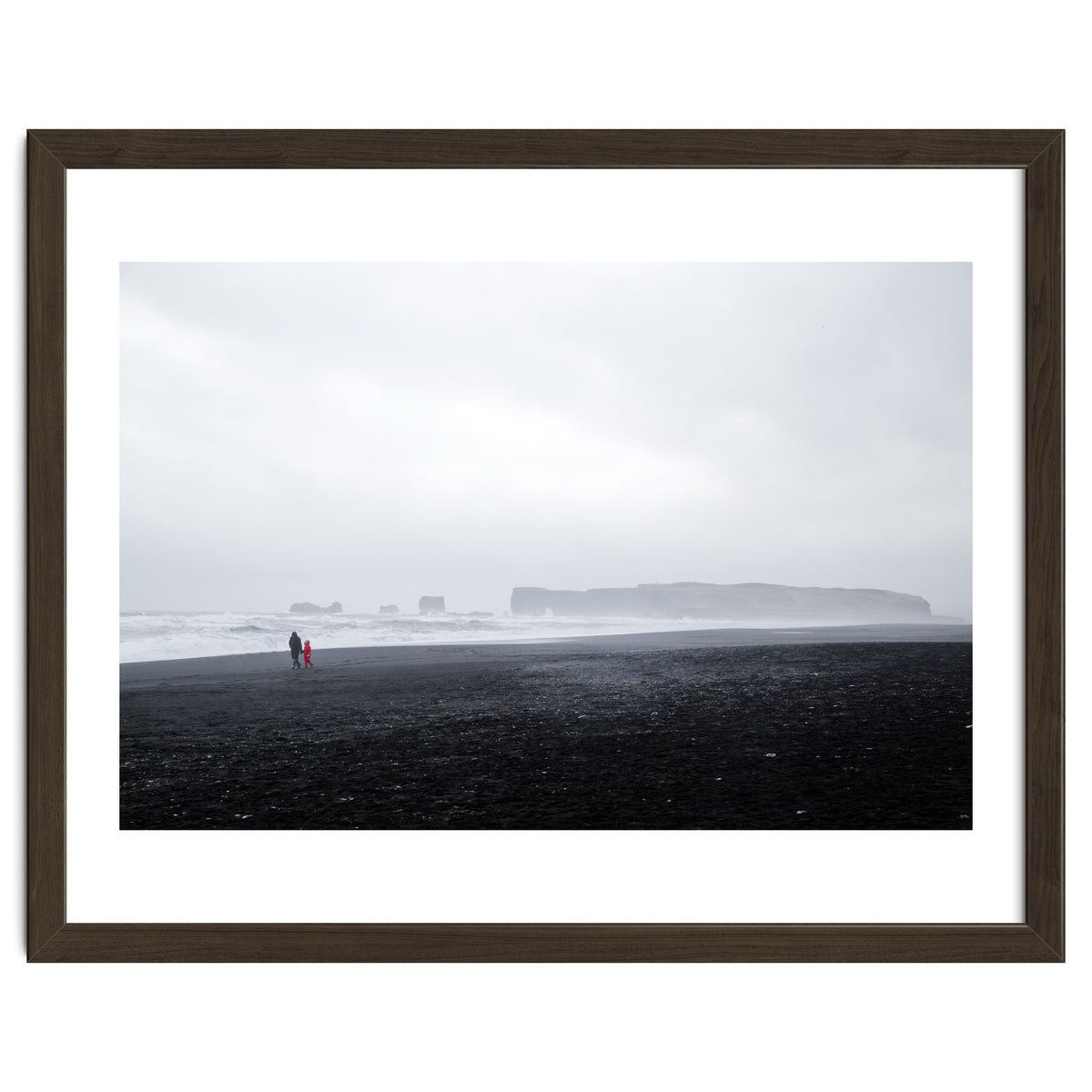 Family walking on the black sand beach - Iceland