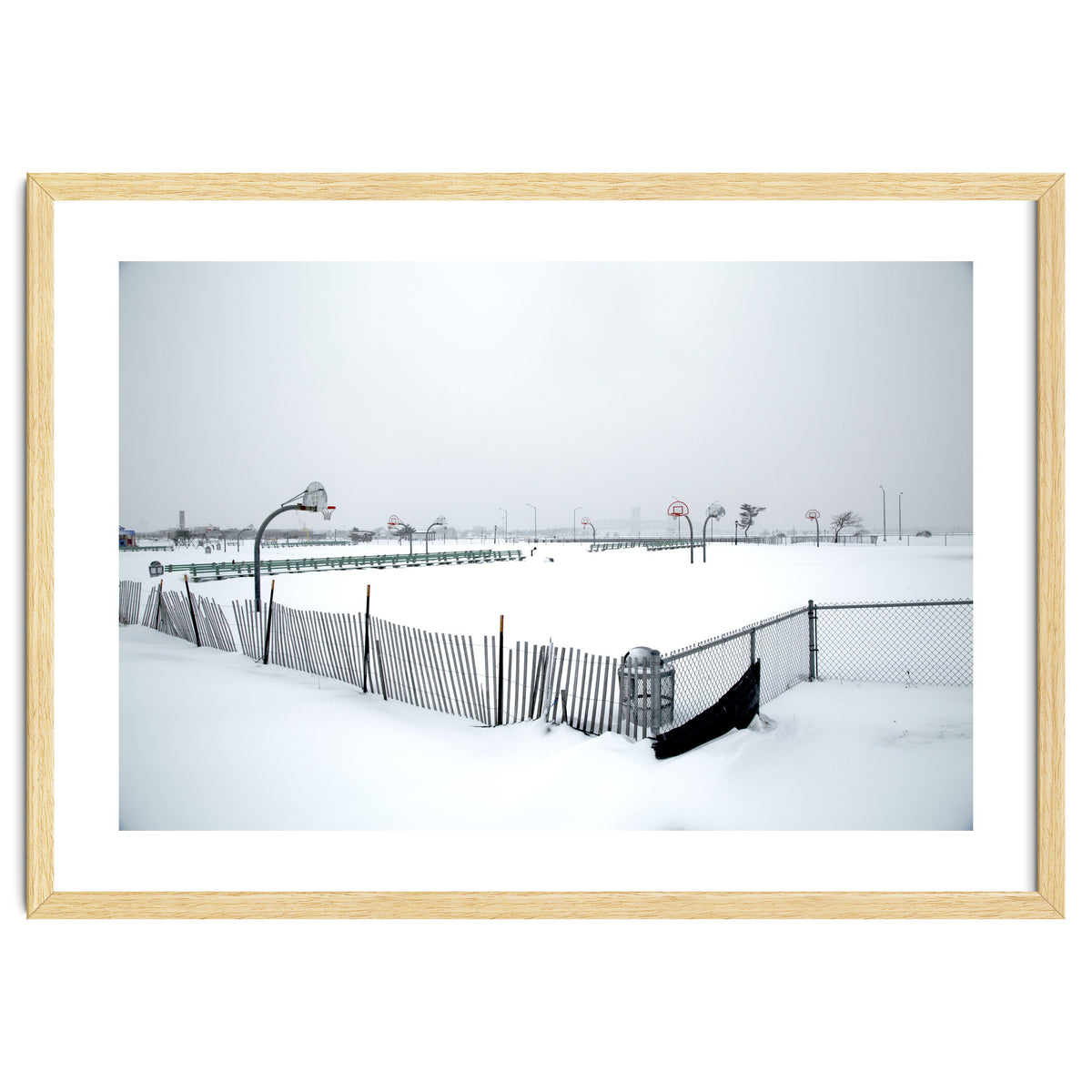 Snow-covered deserted basketball court in winter