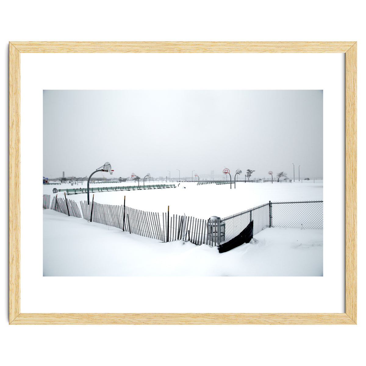 Snow-covered deserted basketball court in winter