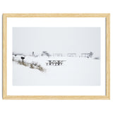 Tables and benches in a snow-covered park thumbnail