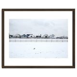 A seagull and snow covered houses thumbnail