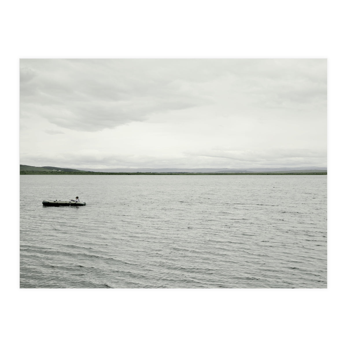 A boy pedaling the Board on the Lake - Iceland (Print Only)