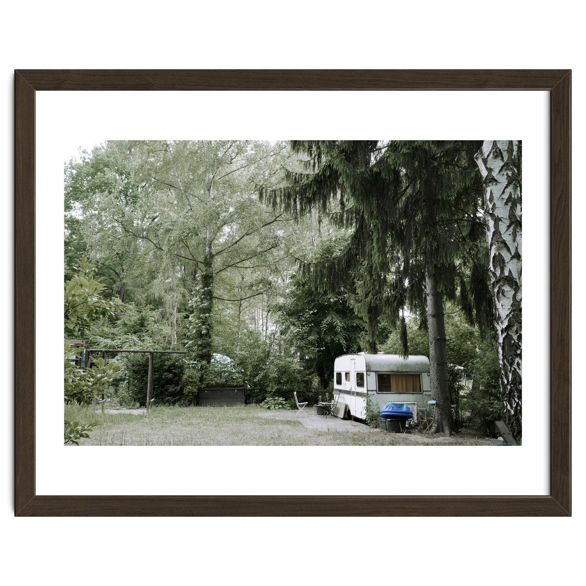 Travel trailer in the green garden