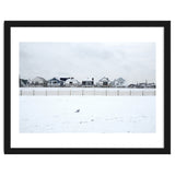 A seagull and snow covered houses thumbnail
