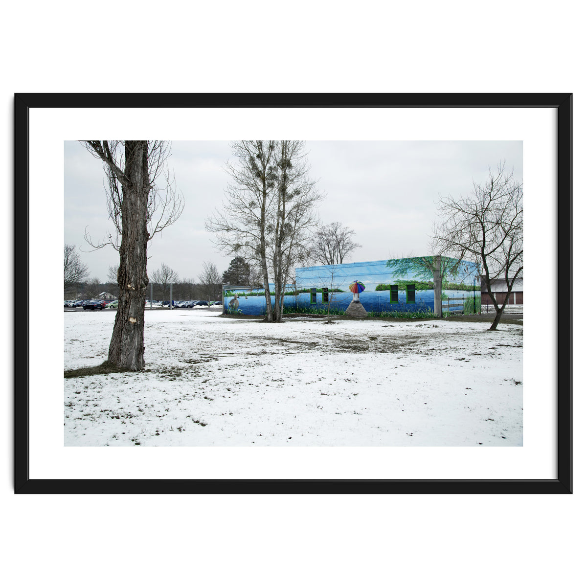 Colorful barn in the snowy ground landscape