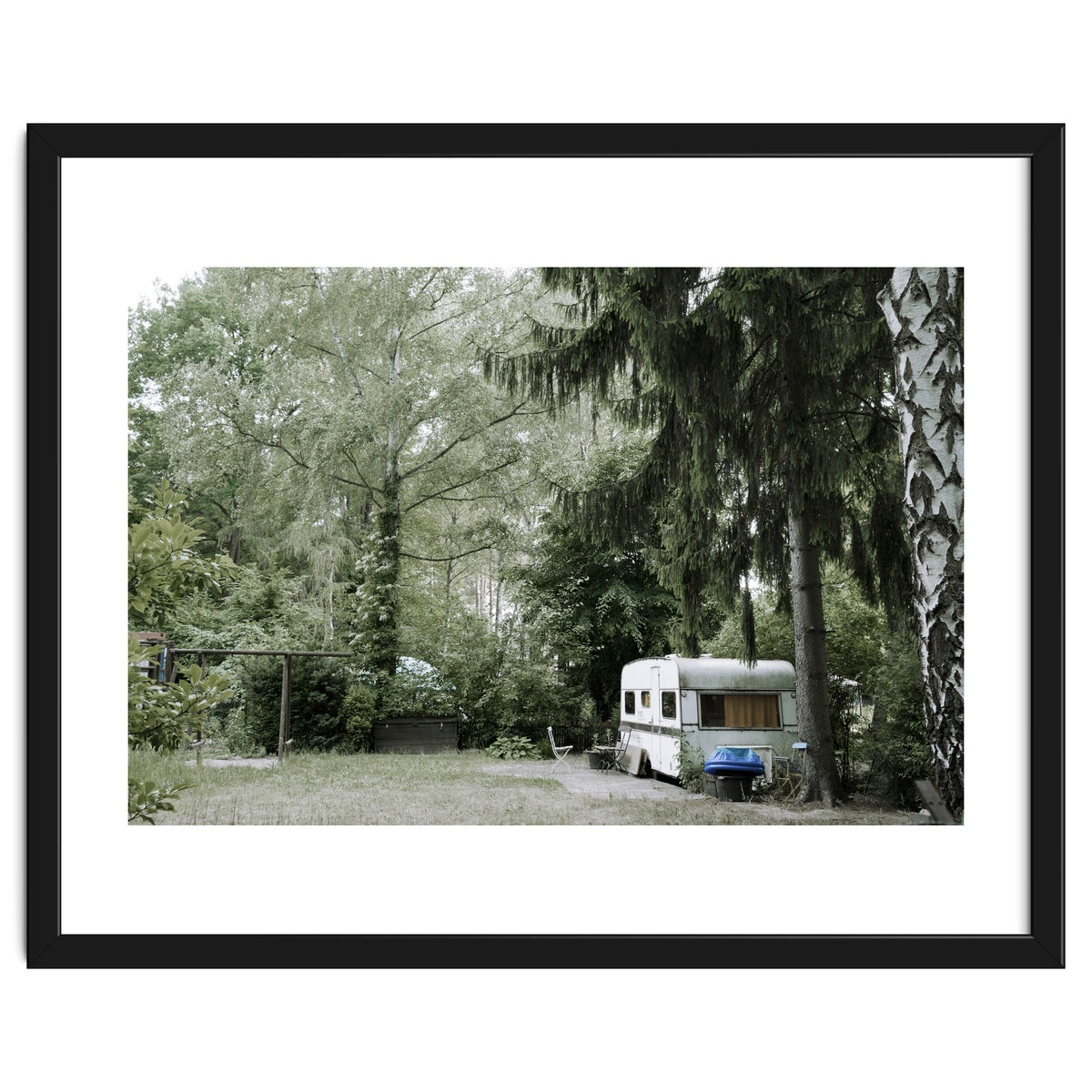 Travel trailer in the green garden