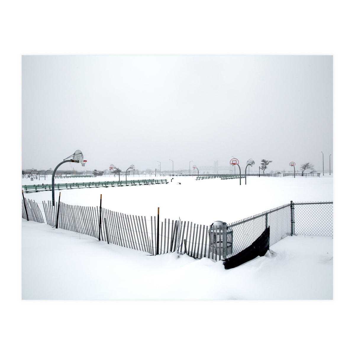 Snow-covered deserted basketball court in winter (Print Only)