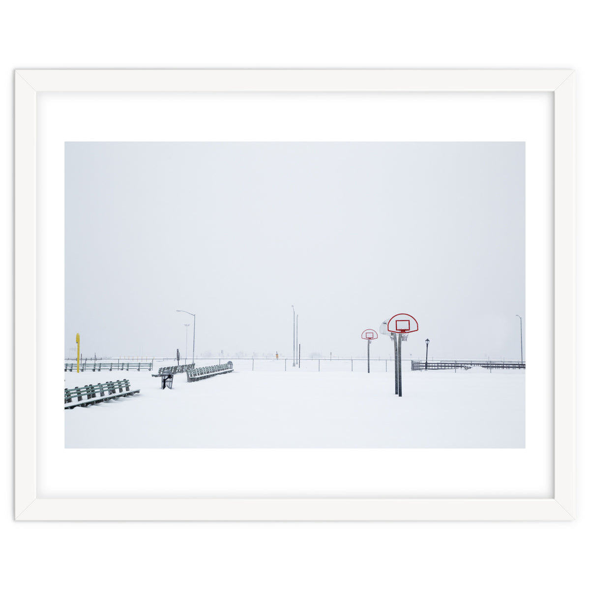 Snow-covered Basketball court and side bench