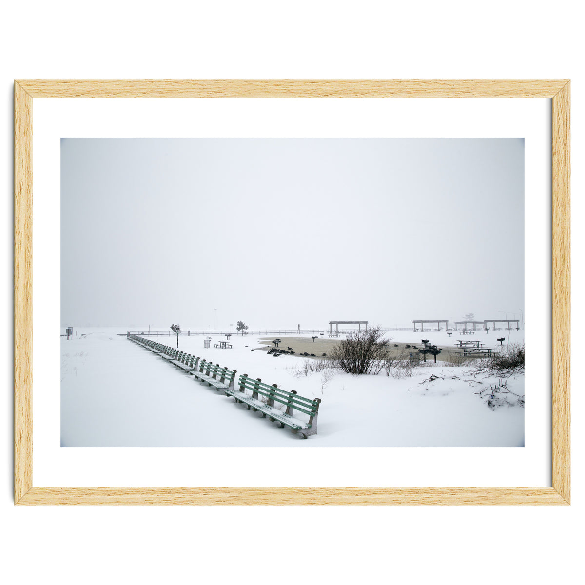 No people on a bench in the snowy winter