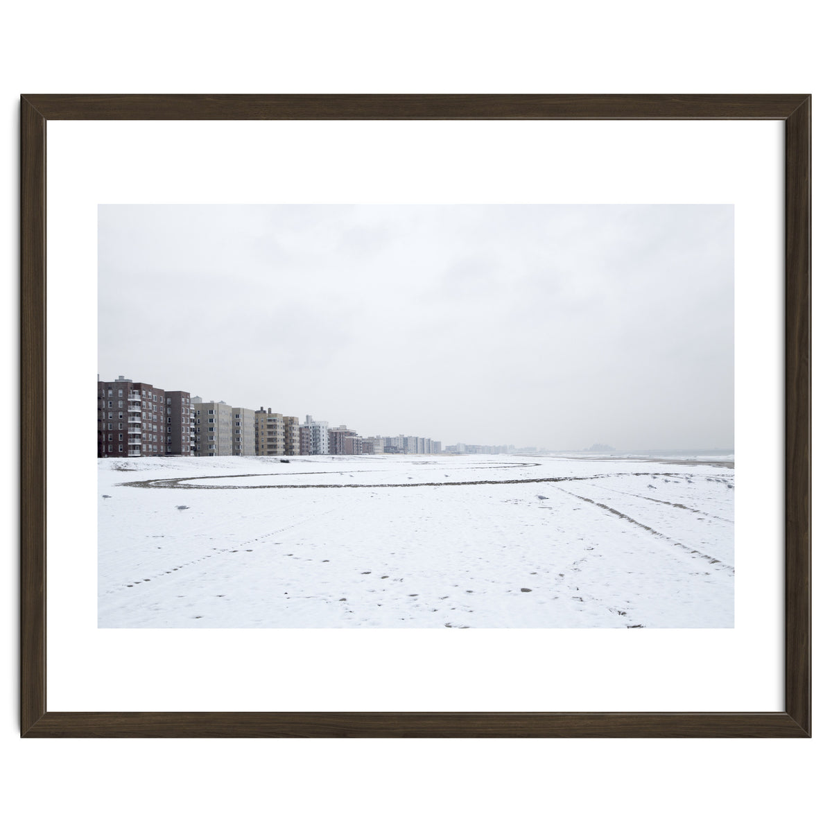 Traces of driving a car on a snowy coast