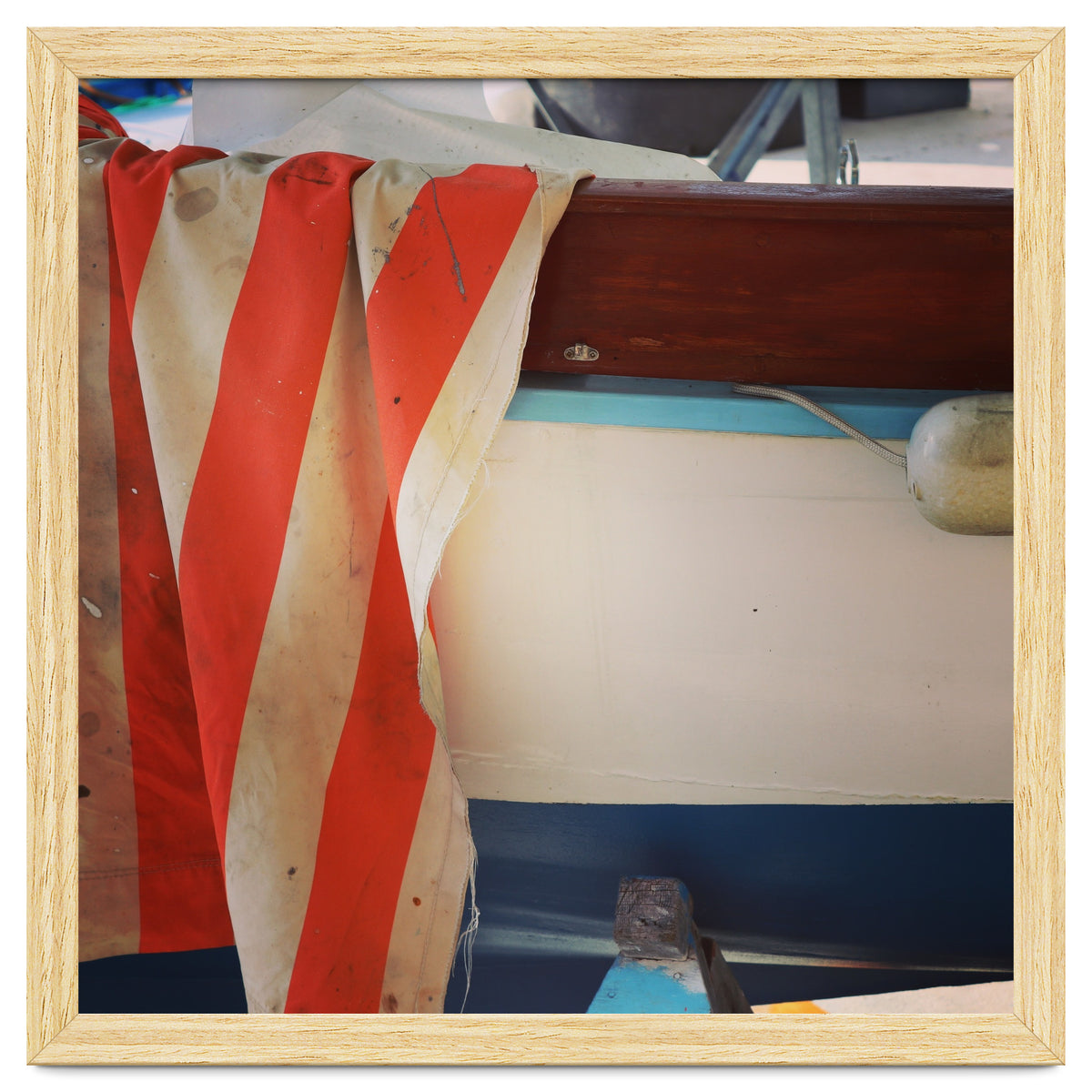 Fishing boat and striped sail