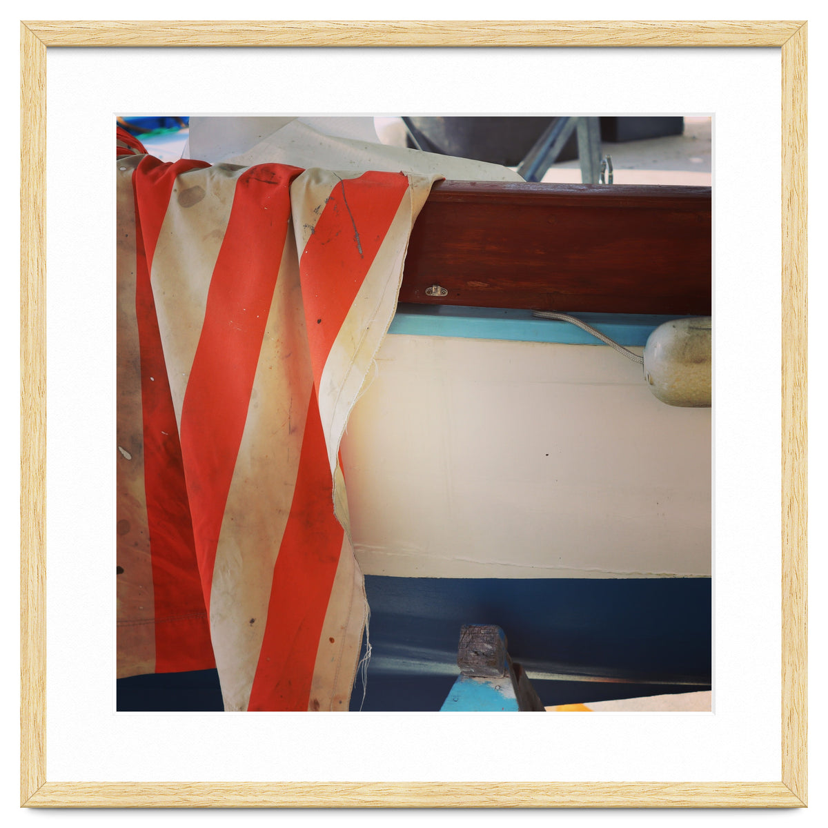 Fishing boat and striped sail
