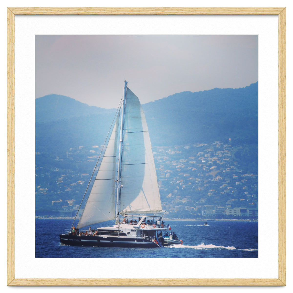 Modern yacht with white sails