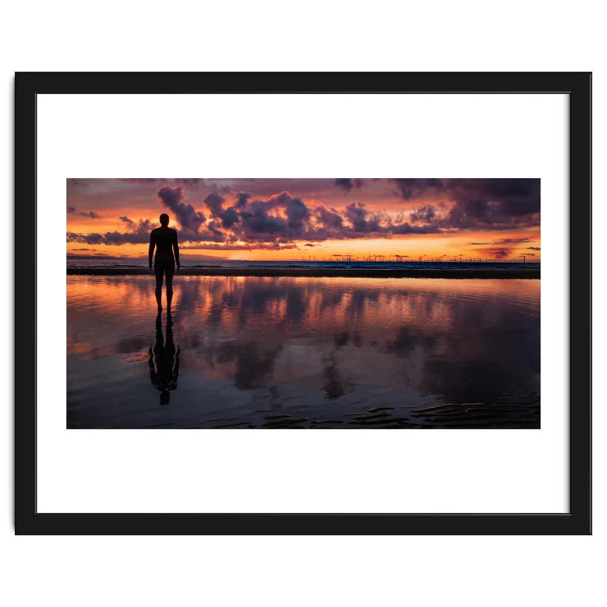 Sunset at Another Place - Sir Antony Gormley statues at Crosby Beach in Merseyside, England.