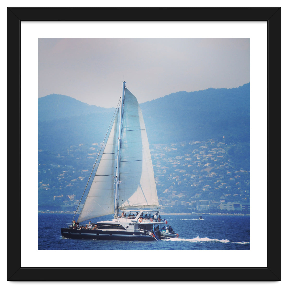 Modern yacht with white sails