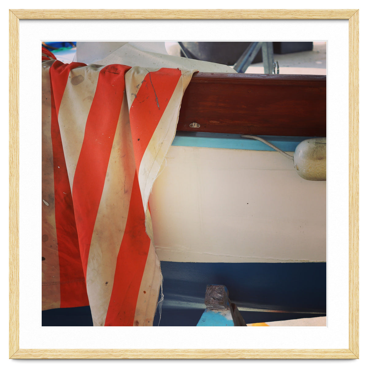 Fishing boat and striped sail