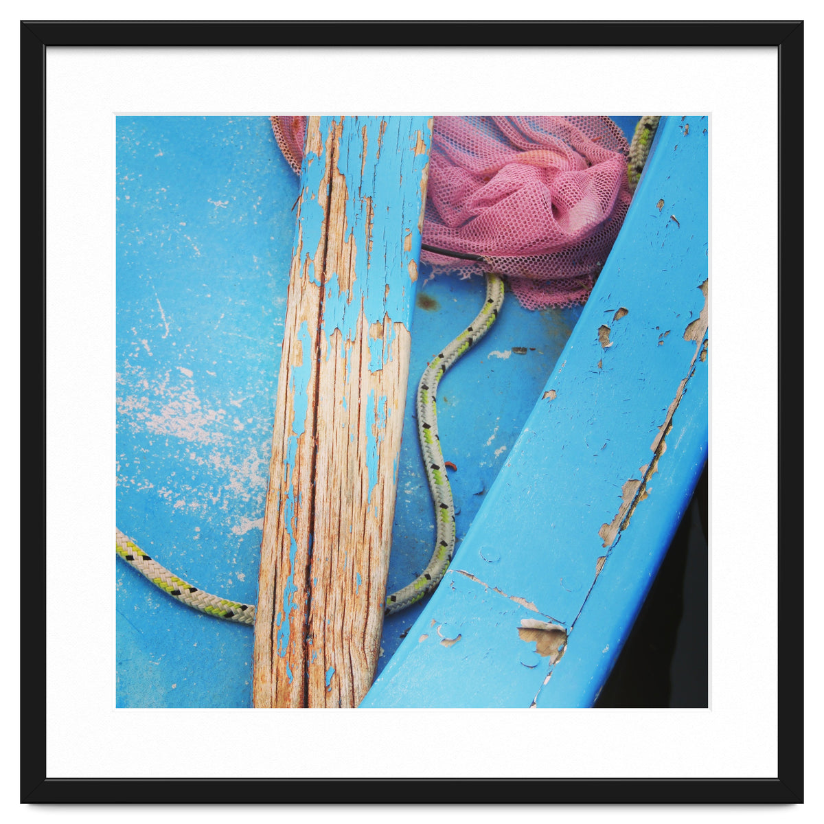 Weathered boat, sail and oar